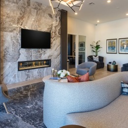 a spacious lounge and a fireplace